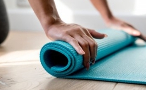 Unrolling a yoga mat